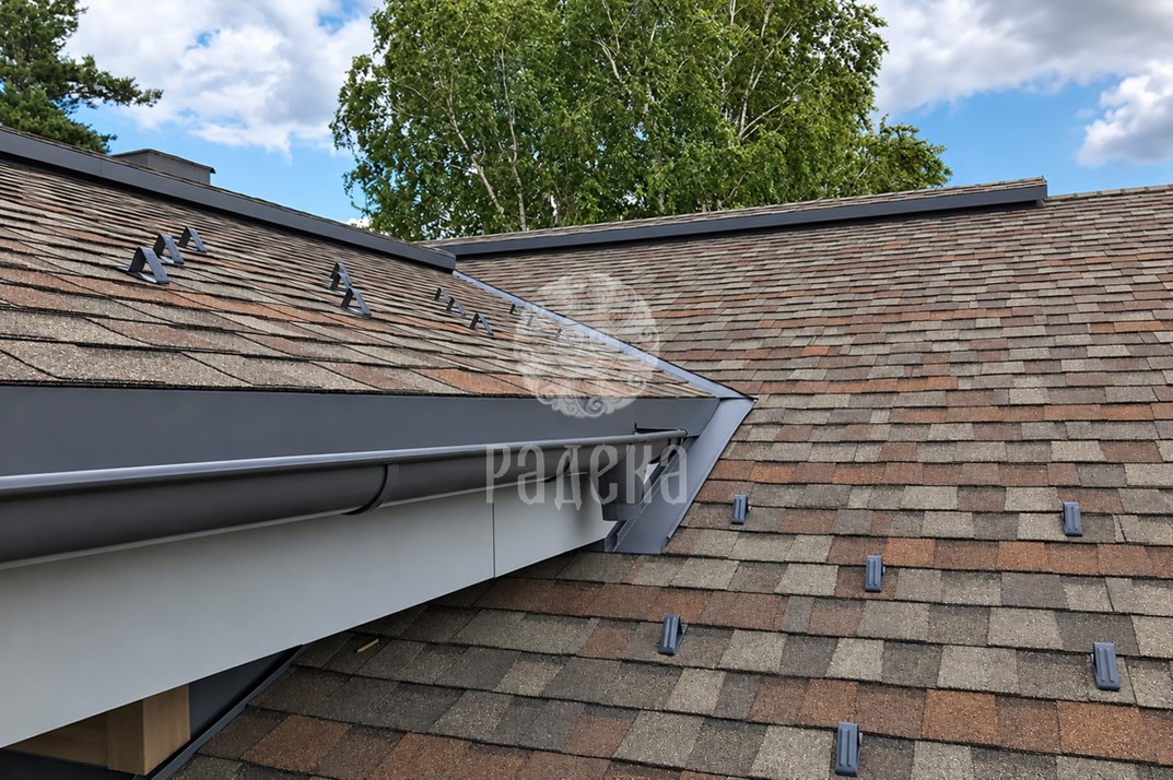 CertainTeed bitumen shingle roofing with metal flashings, an eaves gutter and individual snow guards.